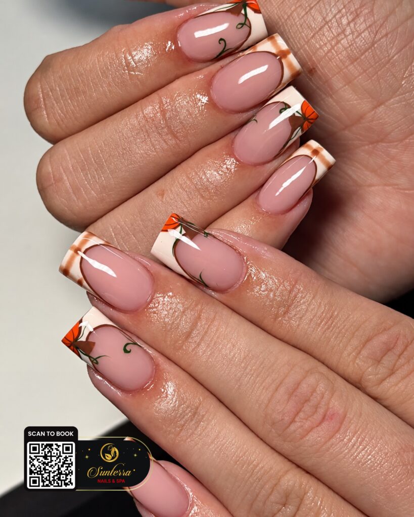 Plaid French and pumpkin vine nails shared by Sunterra Nails & Spa on Instagram