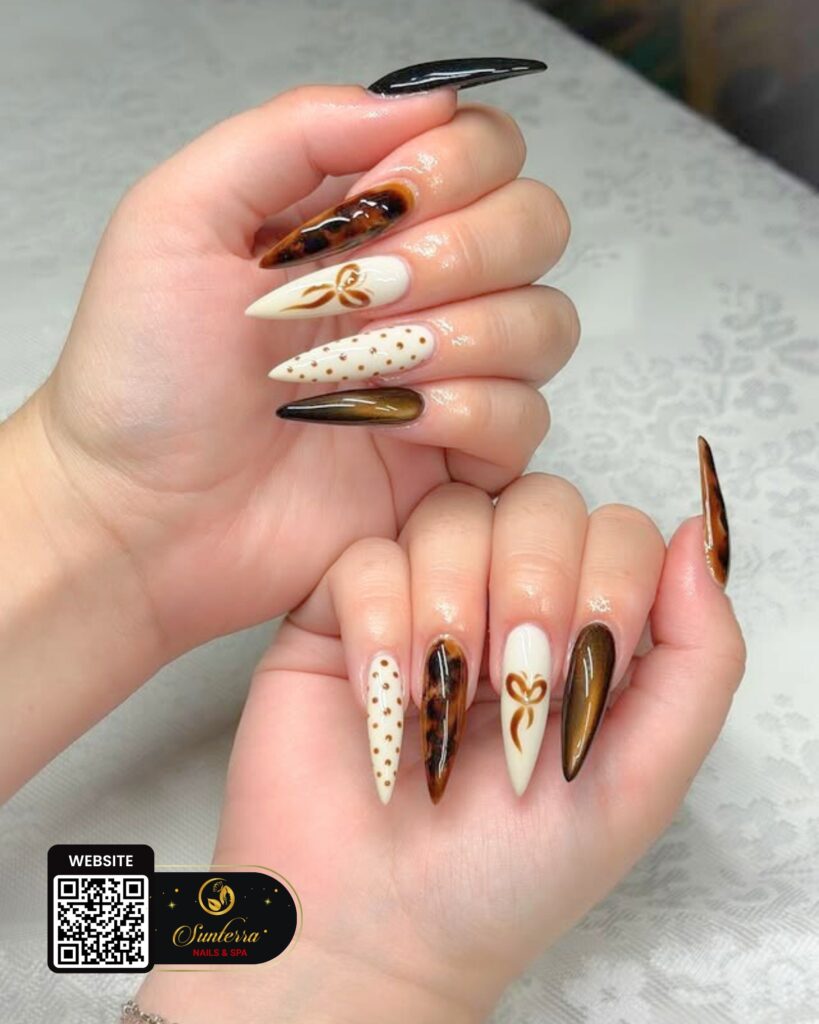 Brown and nude nail art with gold details
